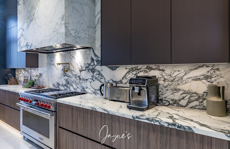 Sleek kitchen with striking marble countertops and modern appliances