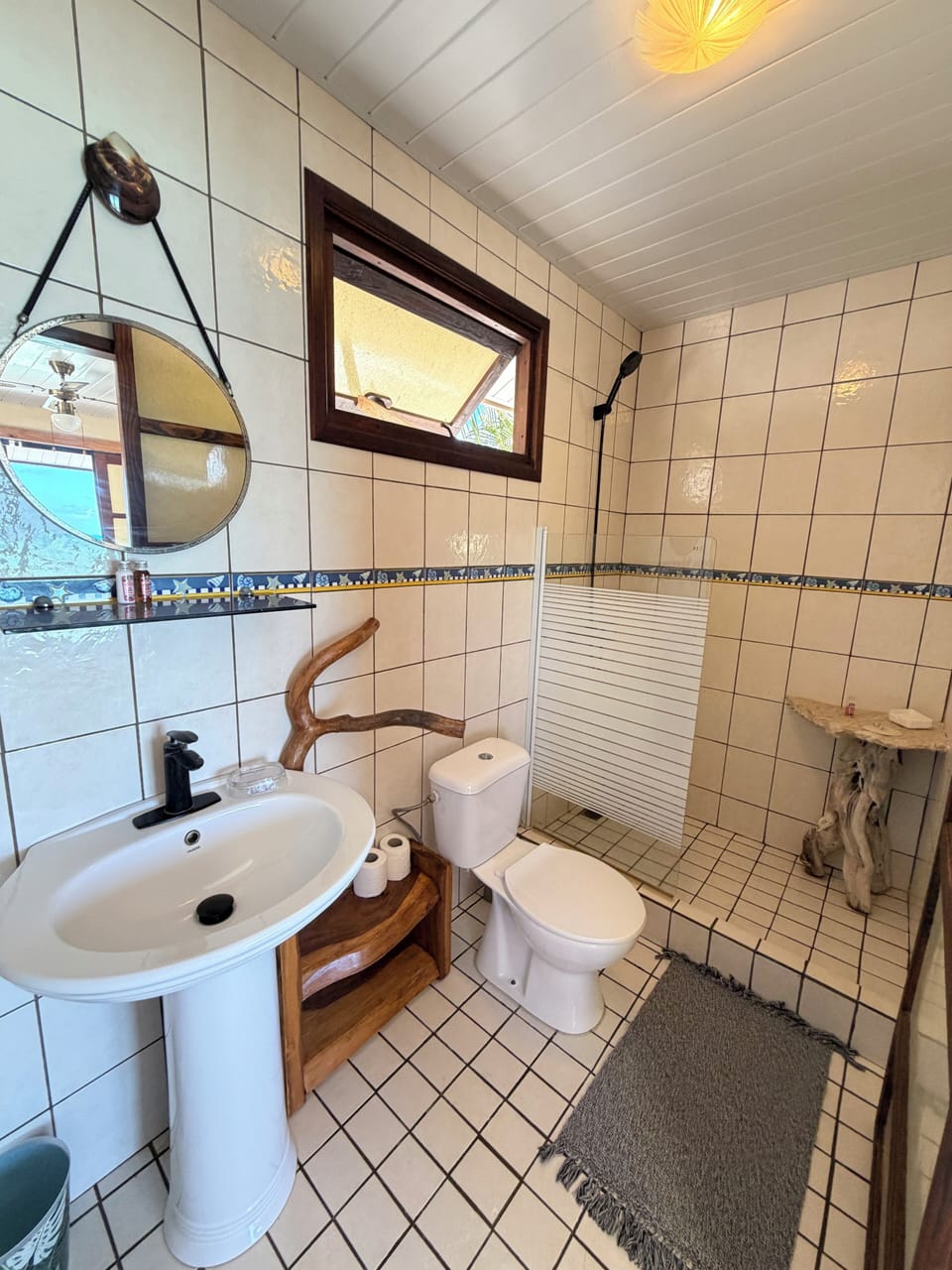 Bungalow | Bathroom | Shower, towels, soap, toilet paper