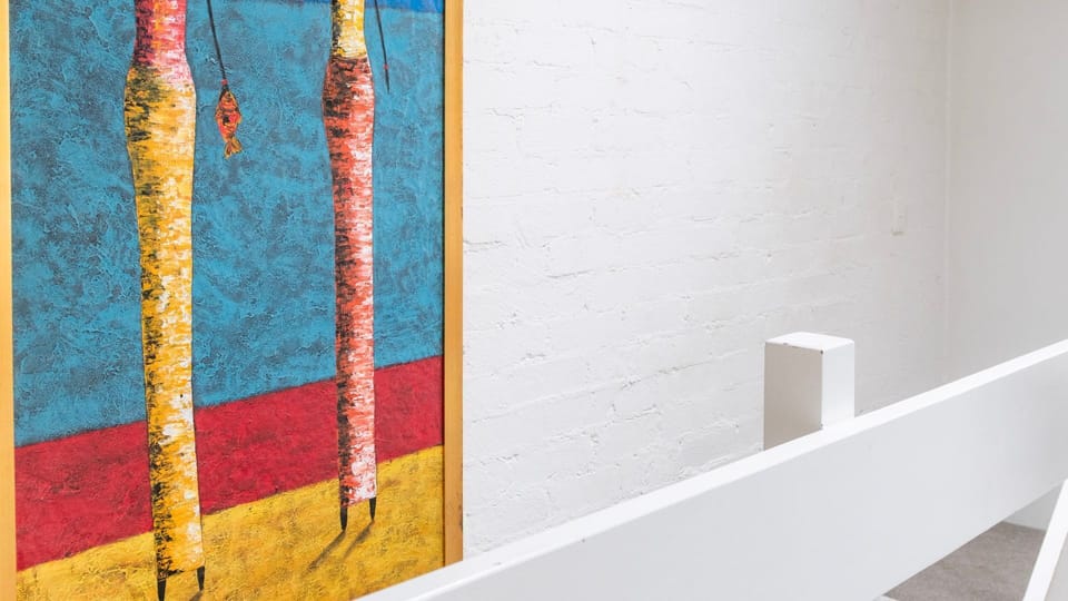 Colourful artwork adding a vibrant touch to the entryway.