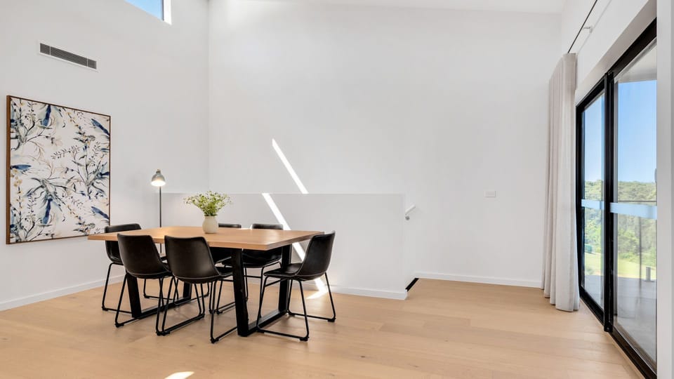 Dining nook with beautiful outlook and balcony access
