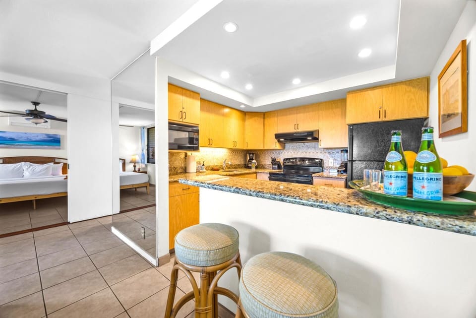A clean and spacious kitchen ready for easy island meals NAP-A24
