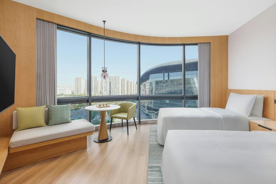 Premium Room, 2 Twin Beds, City View | Down comforters, minibar, in-room safe, individually furnished