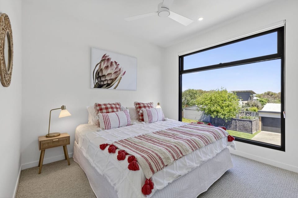 Upstairs King bedroom with built in robes, aircon, heating and fan