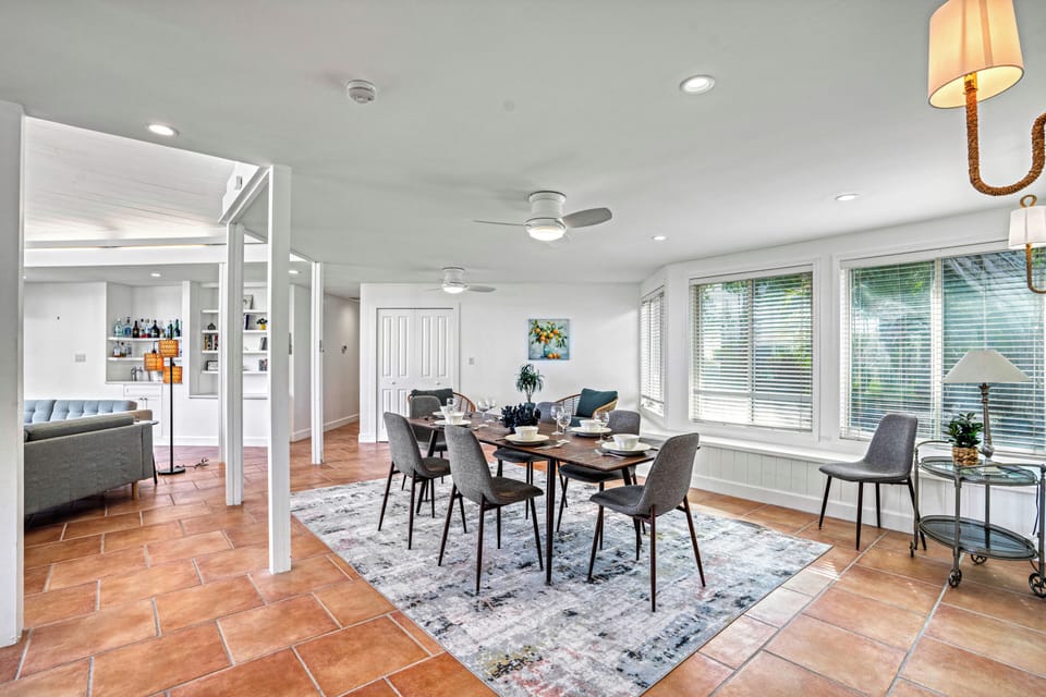 Gather around the dining table, share laughter, food and memories under the glow of modern coastal design.