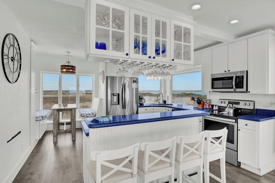 Seating at the bar for 4 to chat with the chef & enjoy the water & marsh views. 