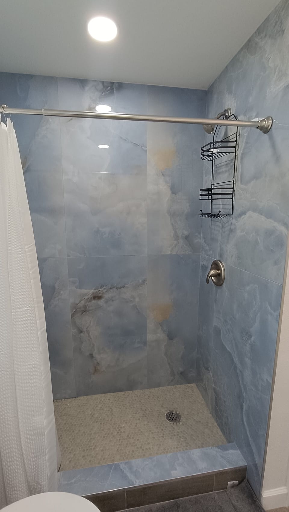 Full bathroom with spacious walk in shower. 