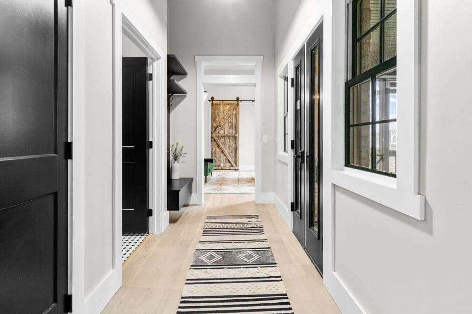 Hallway from living room to the primary bedroom