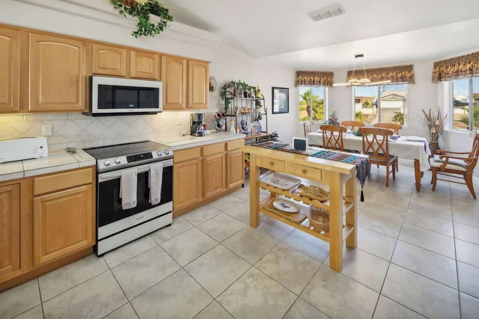 The open, airy kitchen offers ample space & all the comforts of home. 