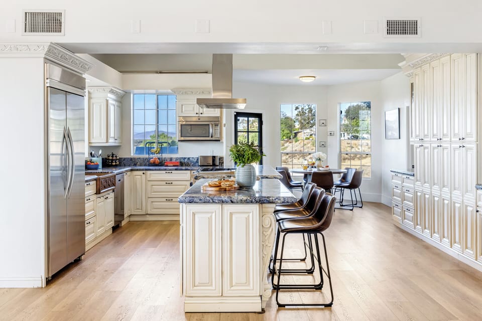 Modern kitchen equipped with stainless steel appliances.