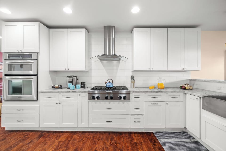 Bright, open kitchen with stainless appliances and plenty of space for group cooking.