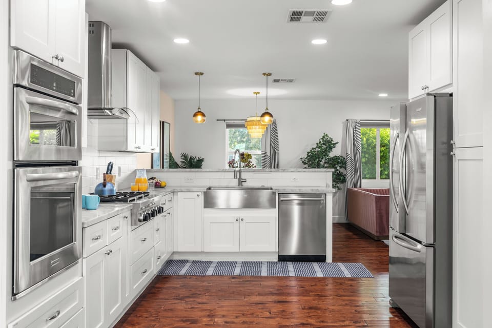 Bright, open kitchen with stainless appliances and plenty of space for group cooking.