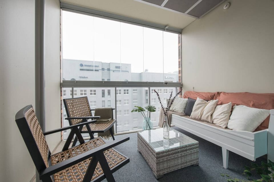 Your private balcony feels like an extra living room, almost year round thanks to the sliding glass windows. A cozy extension to your space, ideal for relaxing no matter the season.