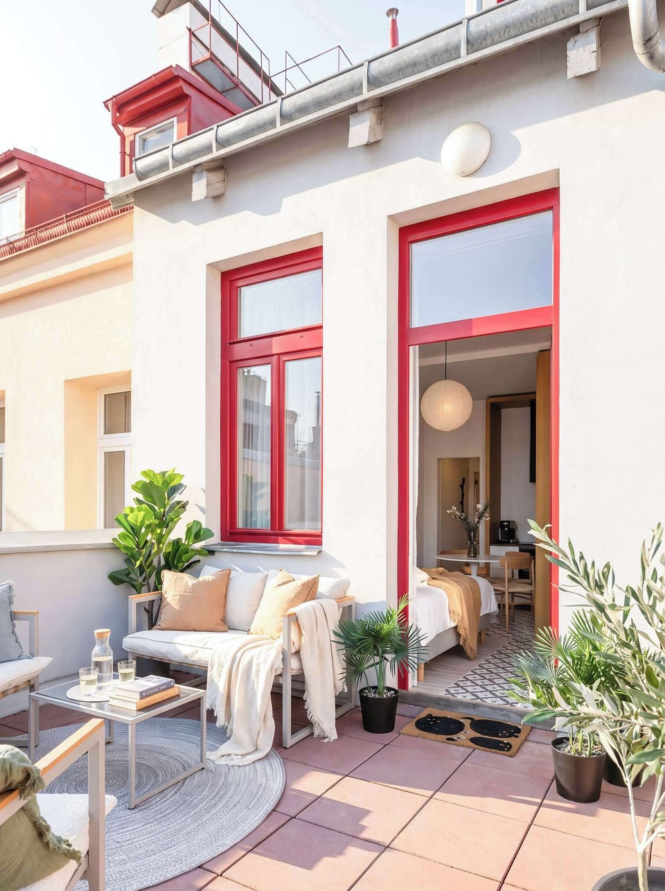 A spacious private terrace with comfortable seating, directly accessible from the apartment.