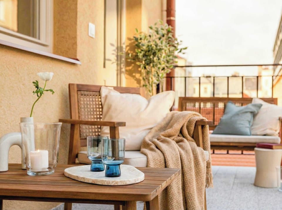 Guests can enjoy a terrace in gallery style, offering outdoor seating right by the apartment.