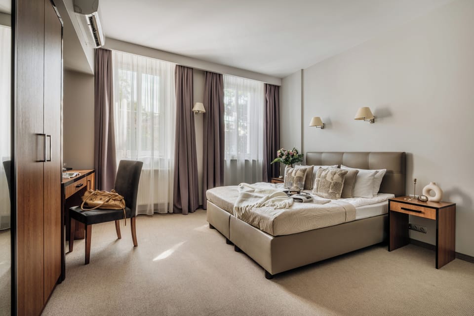 Superior Double Room | Minibar, in-room safe, individually decorated, desk