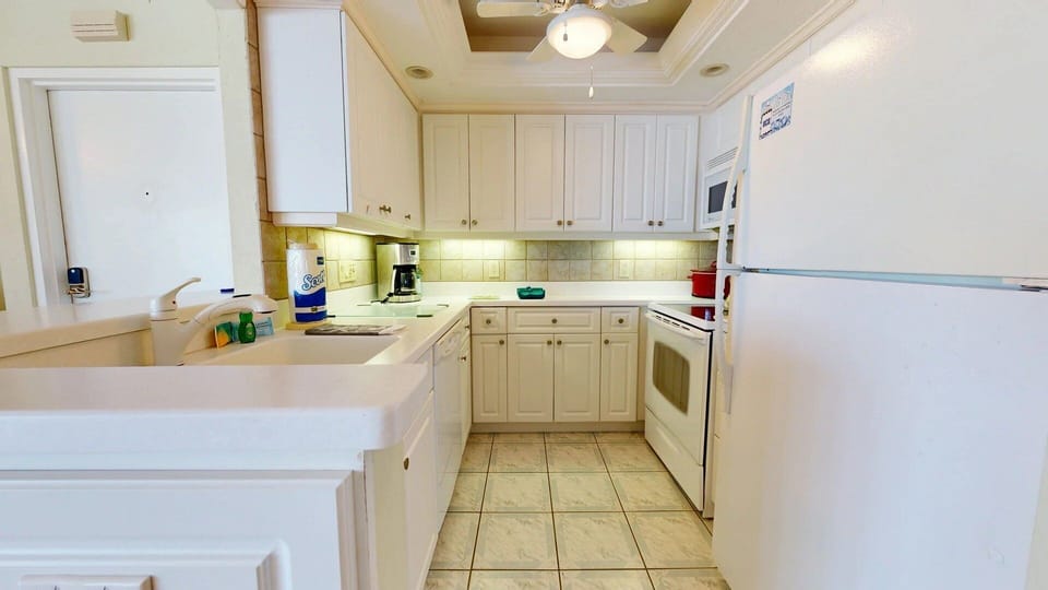 Kitchen is fully stocked for all your cooking needs.