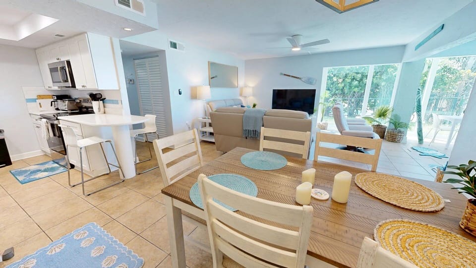 Dining Table Seats 6 with 2 extra seats at the kitchen bar counter.