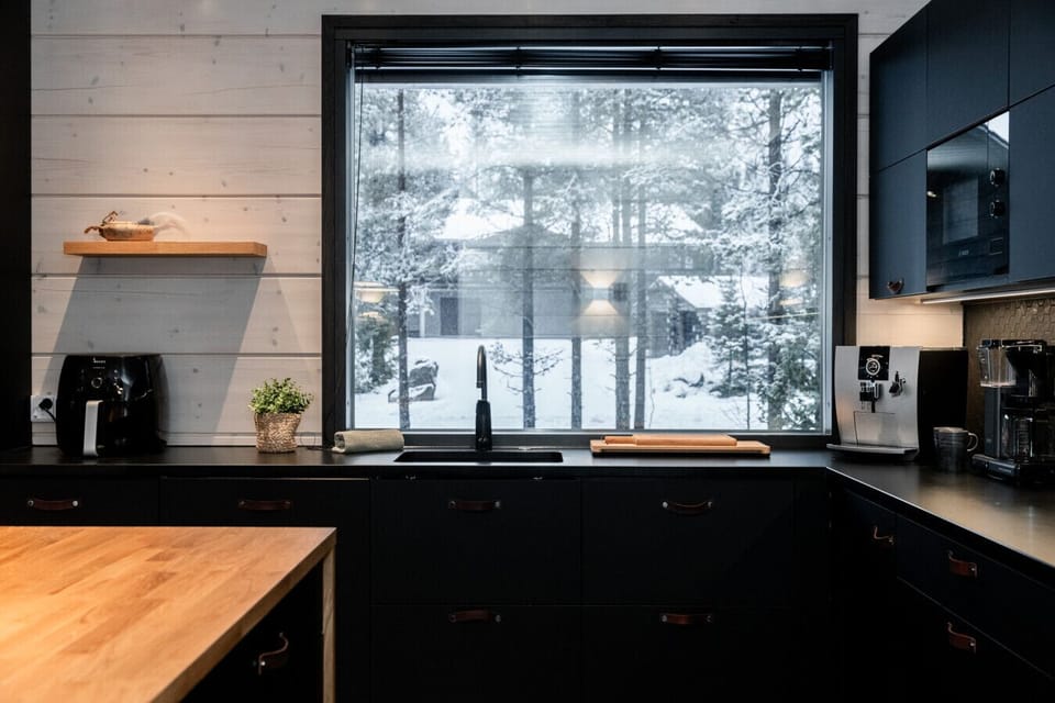 Bright and inviting kitchen featuring a large window that fills the space with natural light.