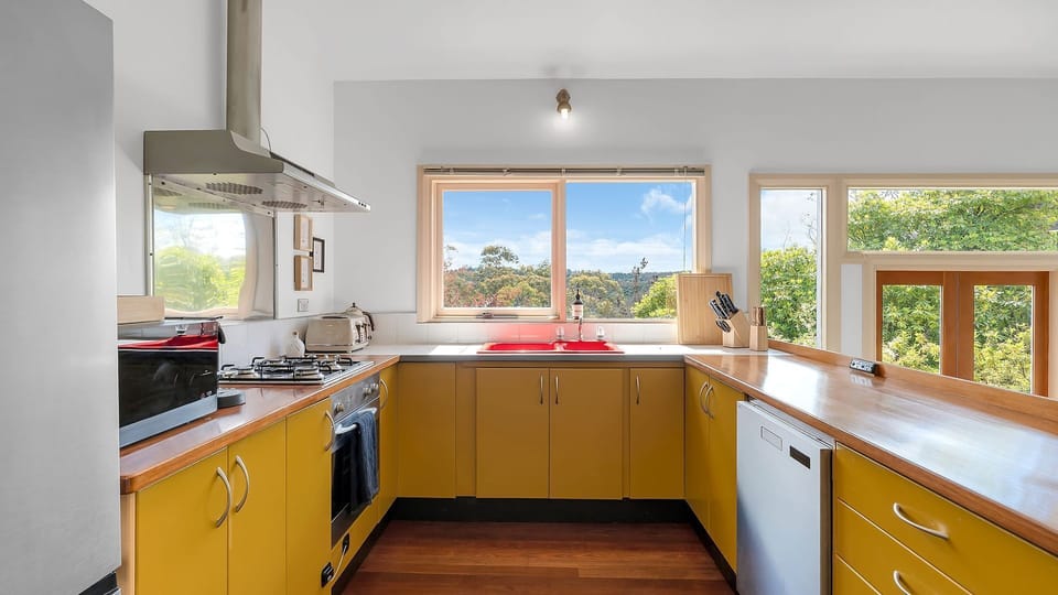 Spacious kitchen with ample bench space and bright views.
