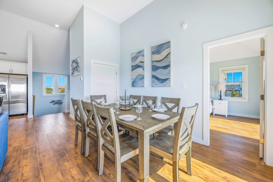 Gather around your beautiful dining table for memorable meals with loved ones in this bright, airy space.