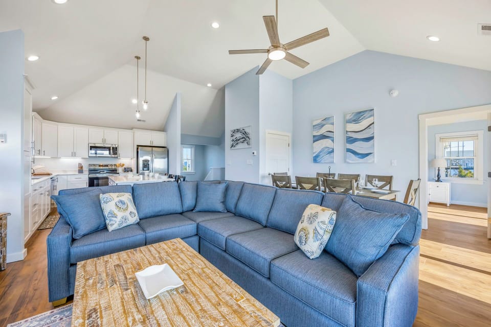 Sink into this plush sectional and enjoy your open living space with soaring ceilings, modern kitchen, and elegant dining area.