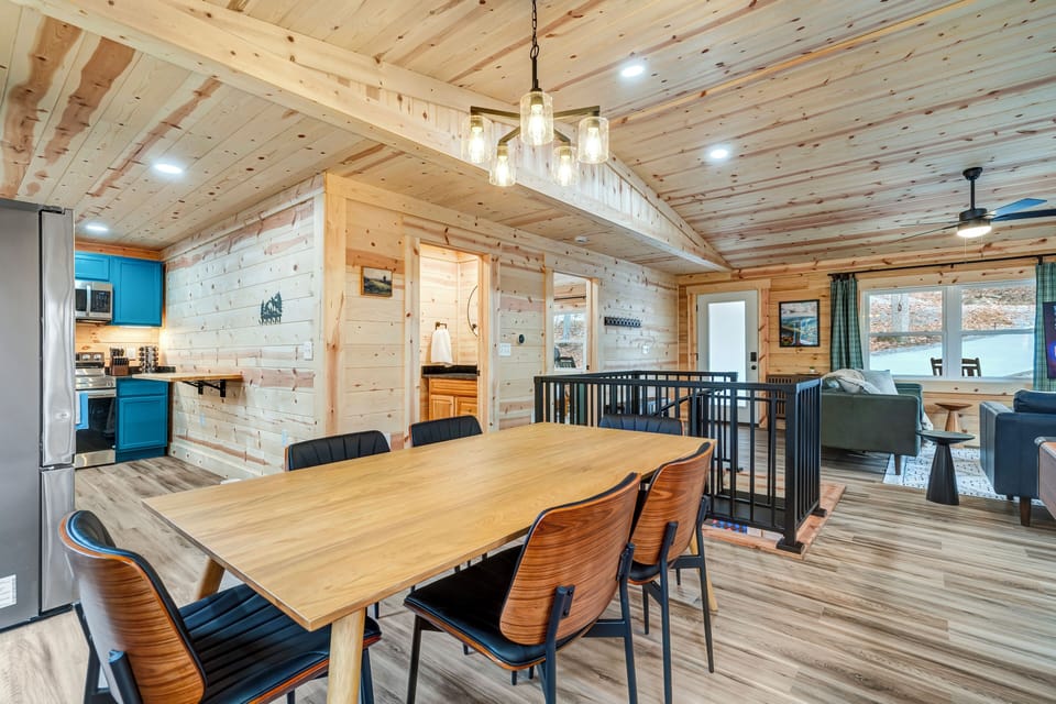 Inviting dining area with a rustic wood table—perfect for meals and memories.
