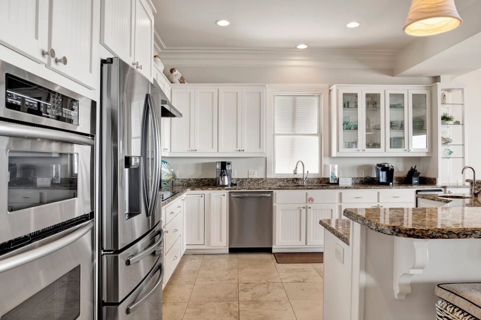 Stone counters and stainless appliances throughout