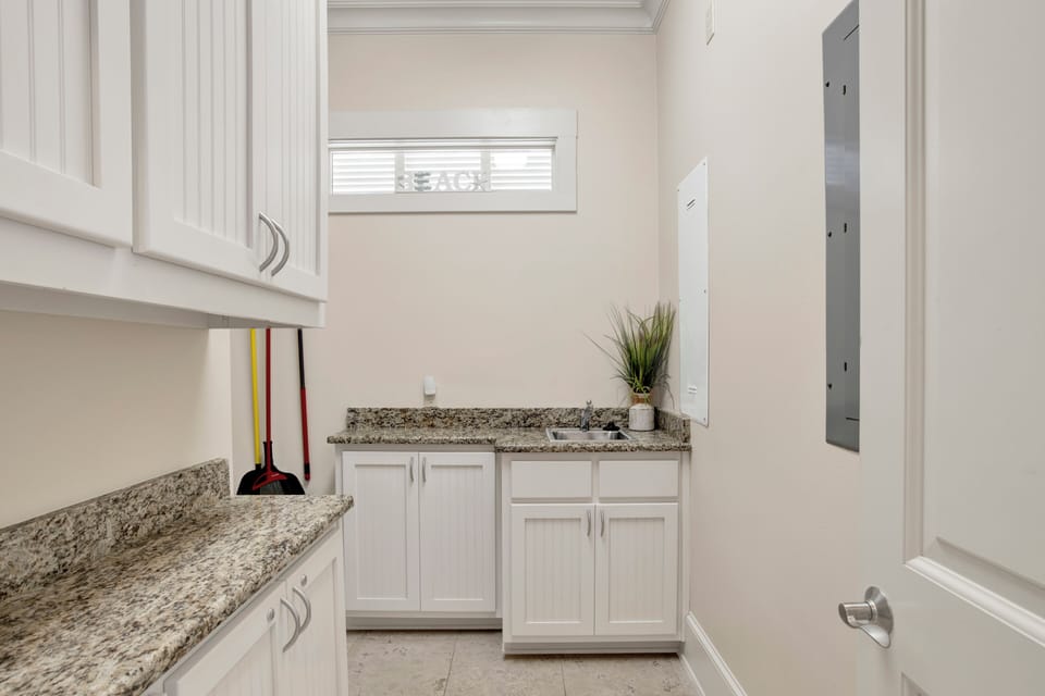 The walk in pantry/laundry room has a sink and plenty of counter space