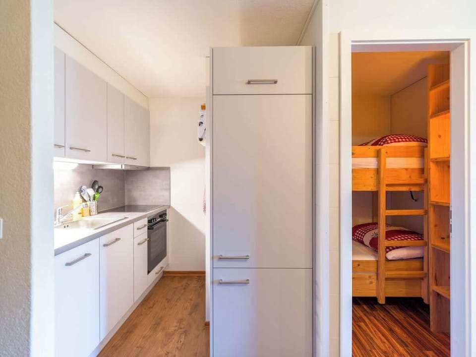 Kitchen entrance with view into living and sleeping area