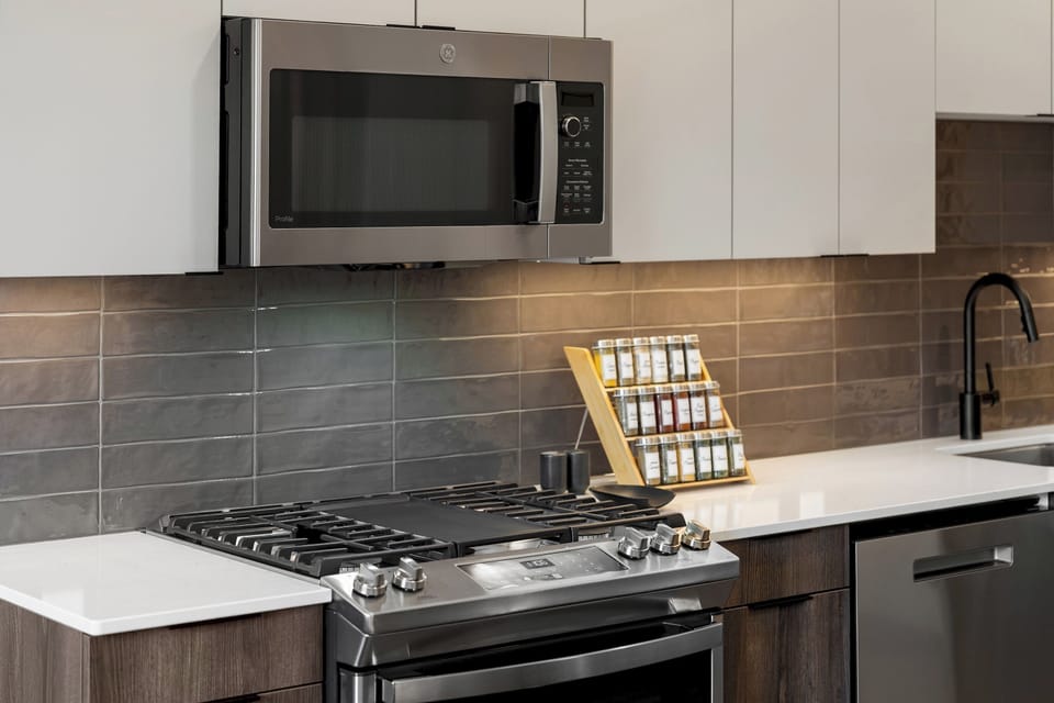 Enjoy the ease of a fully equipped kitchen with contemporary design.
Prepare home-cooked meals or grab a quick bite in style.