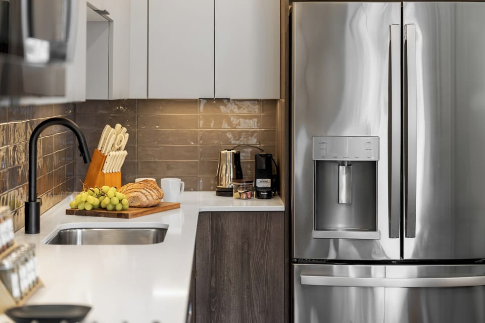 A modern kitchen with stainless steel appliances and clean, elegant lines.
Everything you need for cooking, snacking, or entertaining.