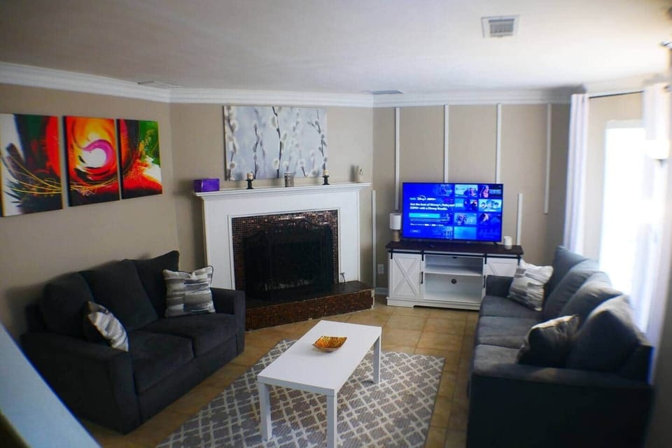 living  room  has  flatscreen fireplace  Hulu and Disney 