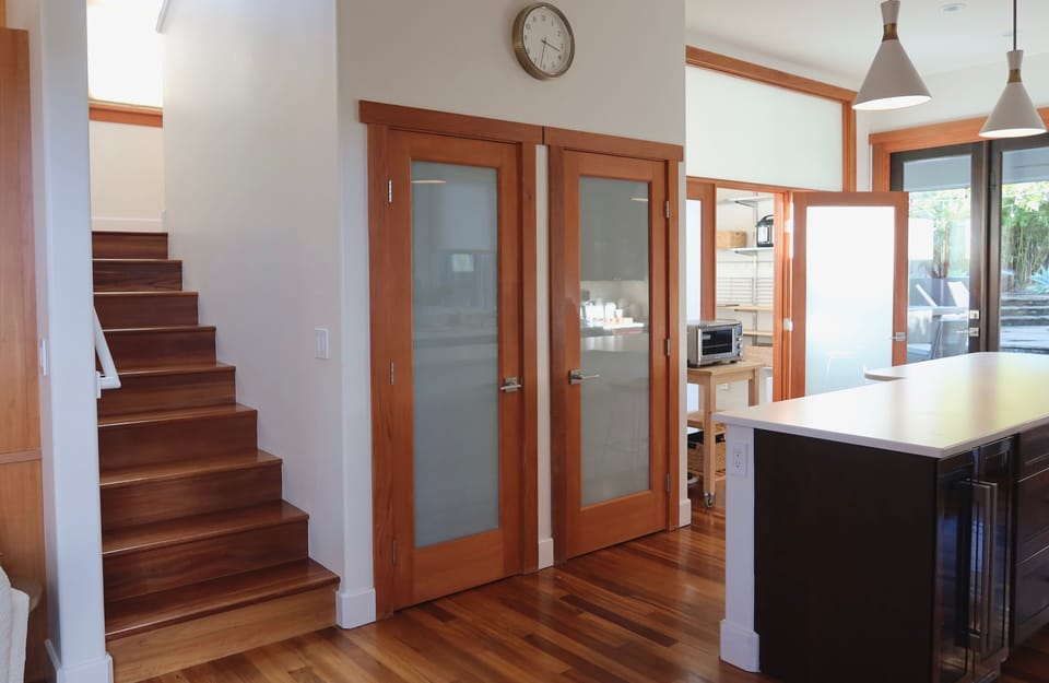 Upstairs heads to the bedrooms, off the kitchen.