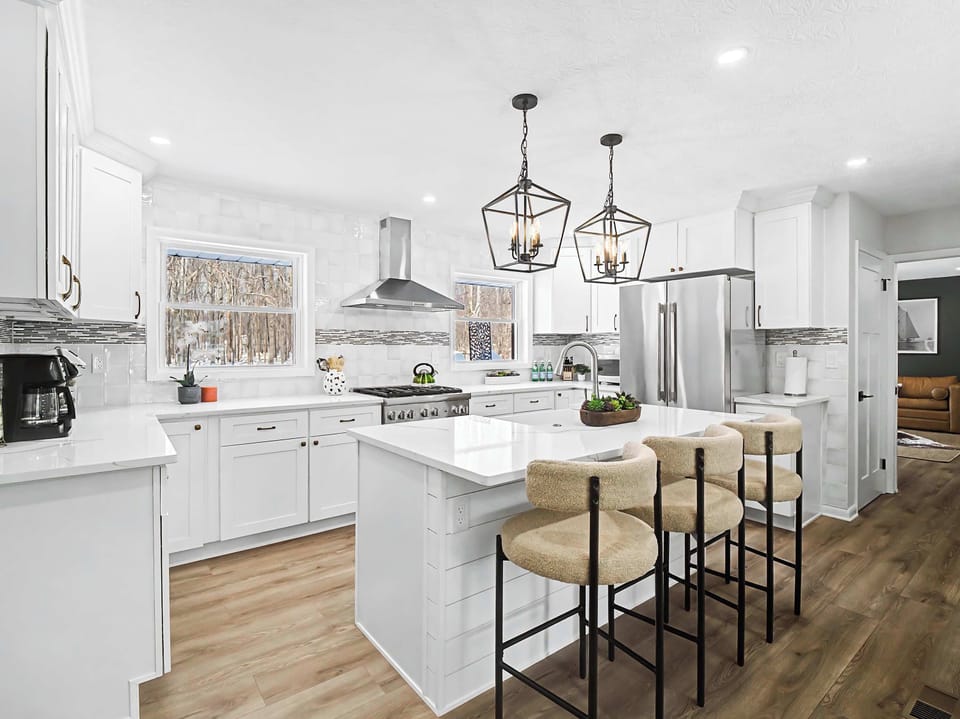 Modern kitchen w/ island seating, sleek finishes & open layout for easy cooking