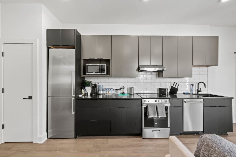 Sleek and functional kitchen layout featuring plenty of counter space for meal prep.