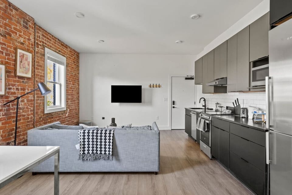 Sleek and functional kitchen layout featuring plenty of counter space for meal prep.