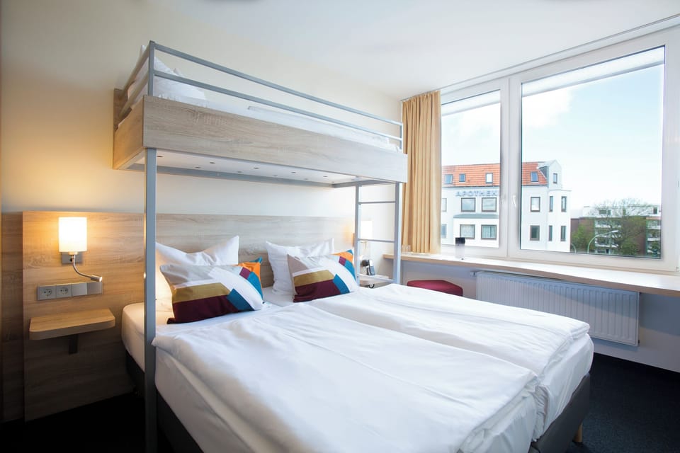 Standard Room, Multiple Beds | In-room safe, desk, soundproofing, iron/ironing board