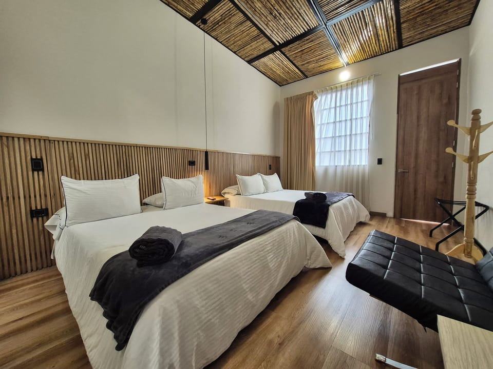 Comfort Quadruple Room | Premium bedding, down comforters, desk, laptop workspace