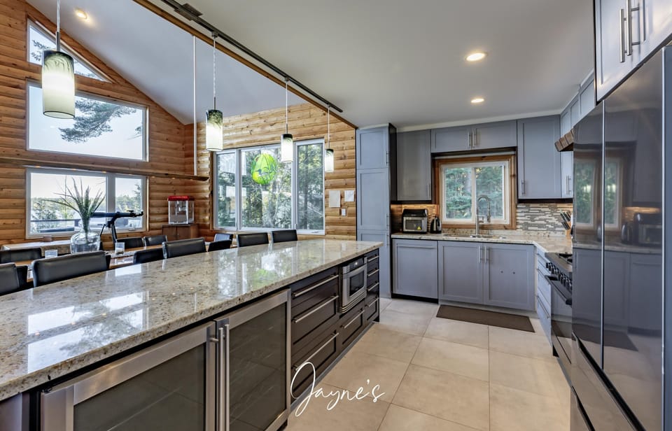 Sleek modern kitchen with spacious island and natural light
