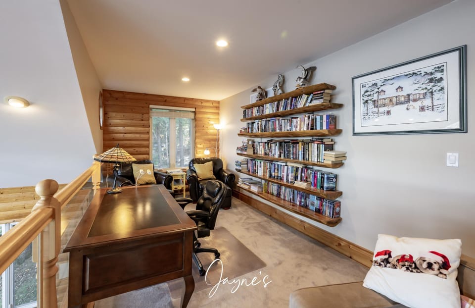 Cozy home office with scenic window views and ample storage