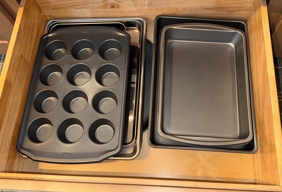 Stocked with baking pans, cookie sheets, muffin tin, pizza pan and pie pan