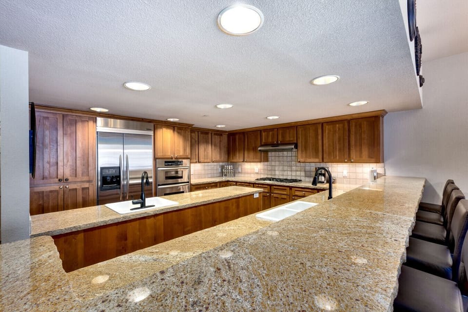 Open and stylish kitchen featuring beautiful granite countertops