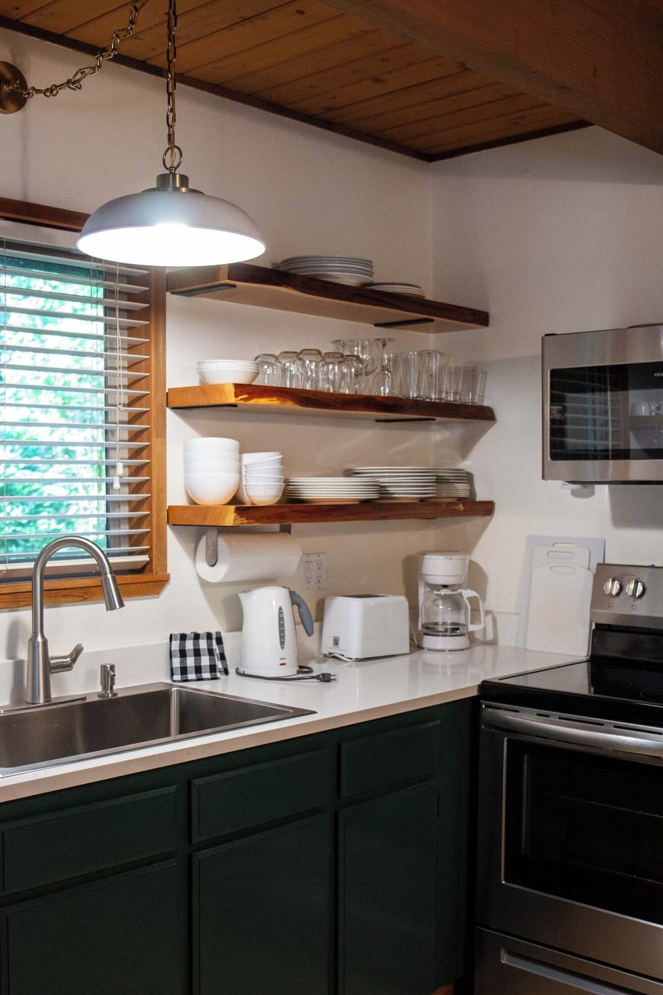 The kitchen is stocked with all the dinnerware and essentials you need