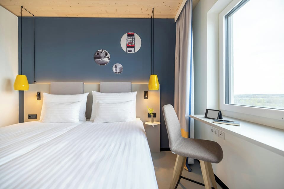 Hypo-allergenic bedding available, in-room safe, desk, laptop workspace