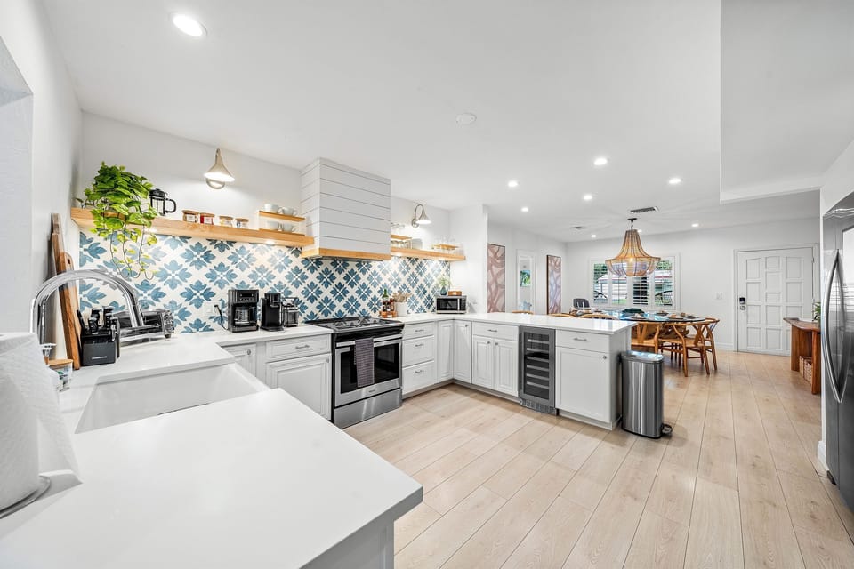 Fully equipped and stylish! Our modern kitchen features stainless steel appliances, ample prep space, and charming open shelving with all the essentials.