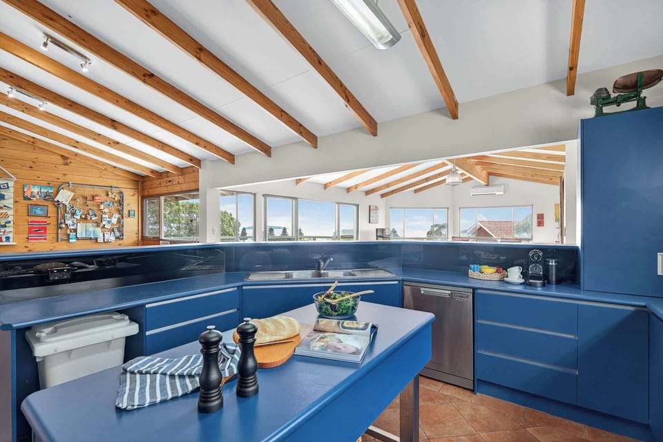 Fully equipped kitchen with panoramic views across the open-plan living space