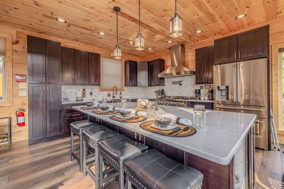 This bright and airy space features a beautifully designed kitchen that seamlessly flows into the dining area, making it ideal for entertaining and family gatherings.