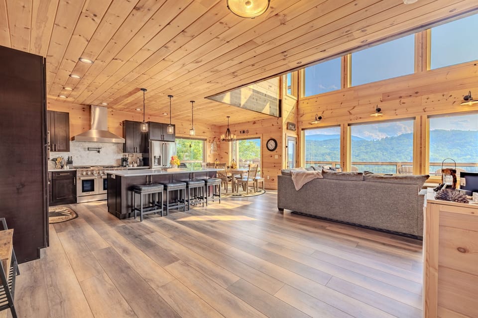 The main living area is a true showstopper. From the sleek, modern kitchen to the cozy living room, every space is designed to take full advantage of the breathtaking scenery outside.