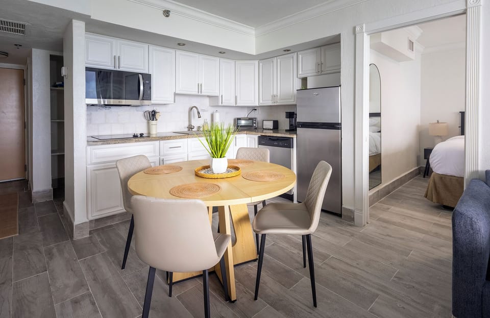 Bright, fully equipped kitchen with modern white cabinetry