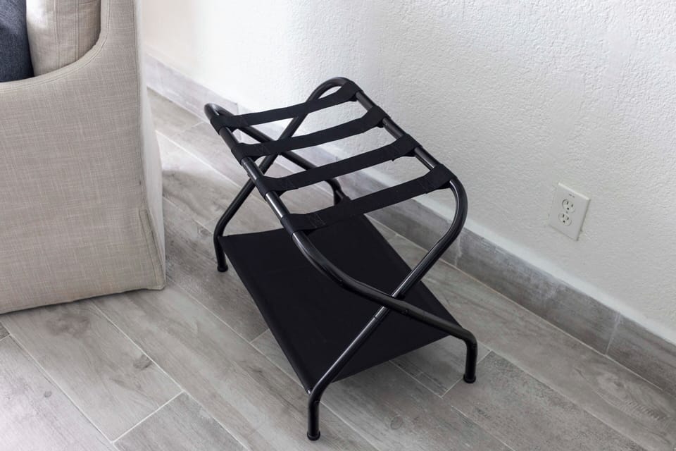Two sturdy luggage racks provide easy unpacking and organized storage.